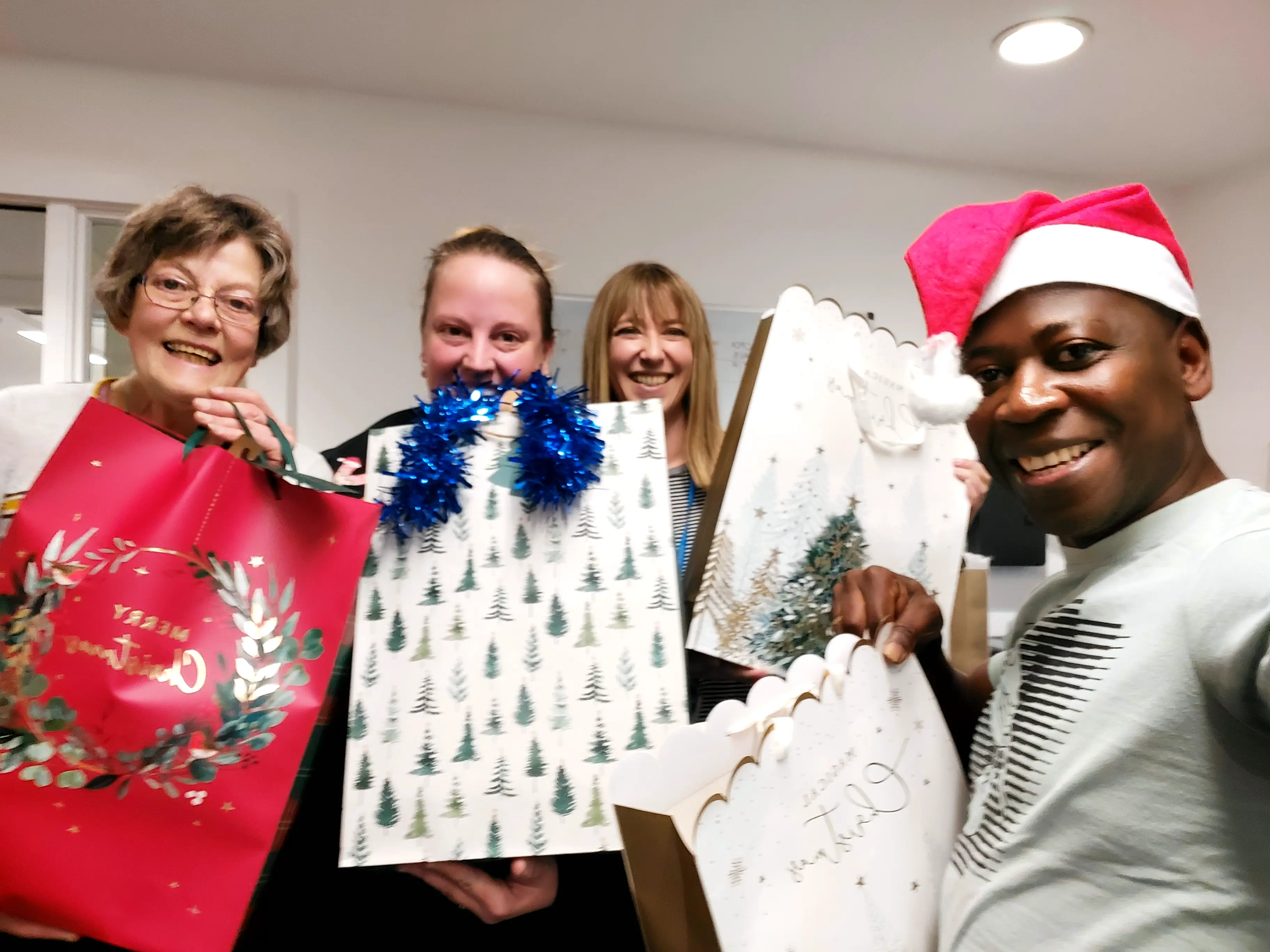 Community members receiving Christmas gifts
